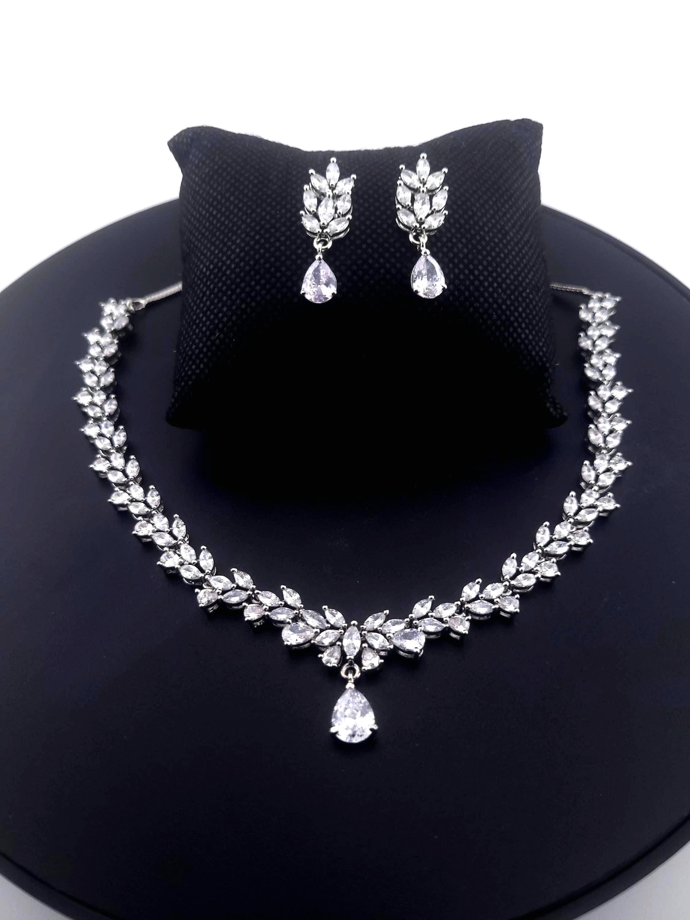 Clean silver plated geometric teardrop crystal accessory matrix map