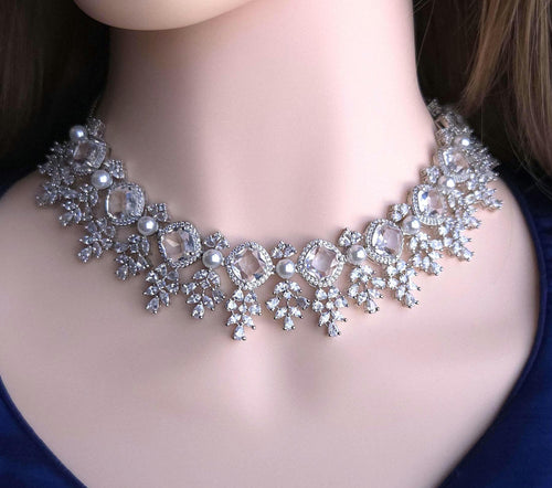 Polished silver tone cluster crystal string with pearl terminals group