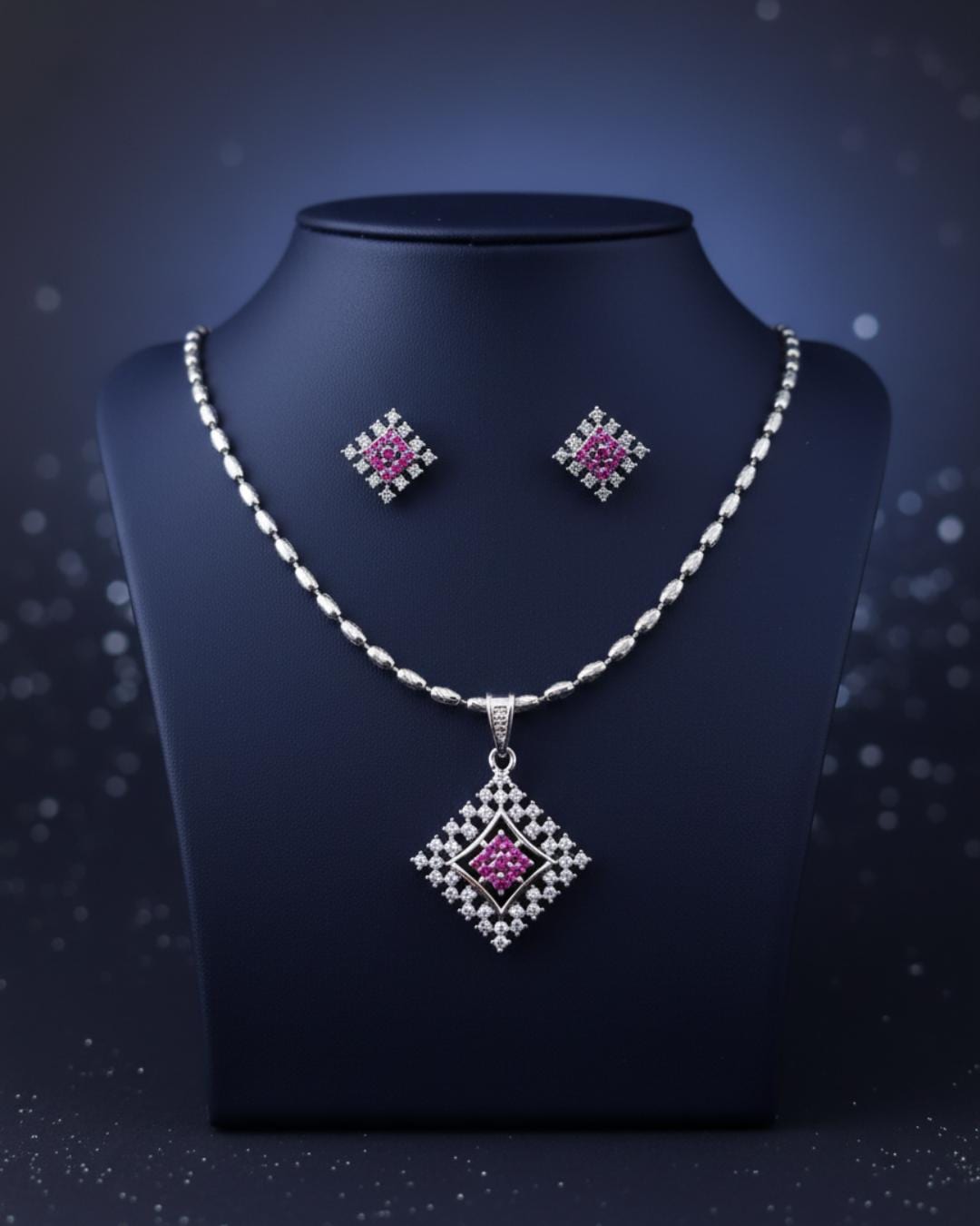 Diamond profile polished silver base ruby colored zircon display pack