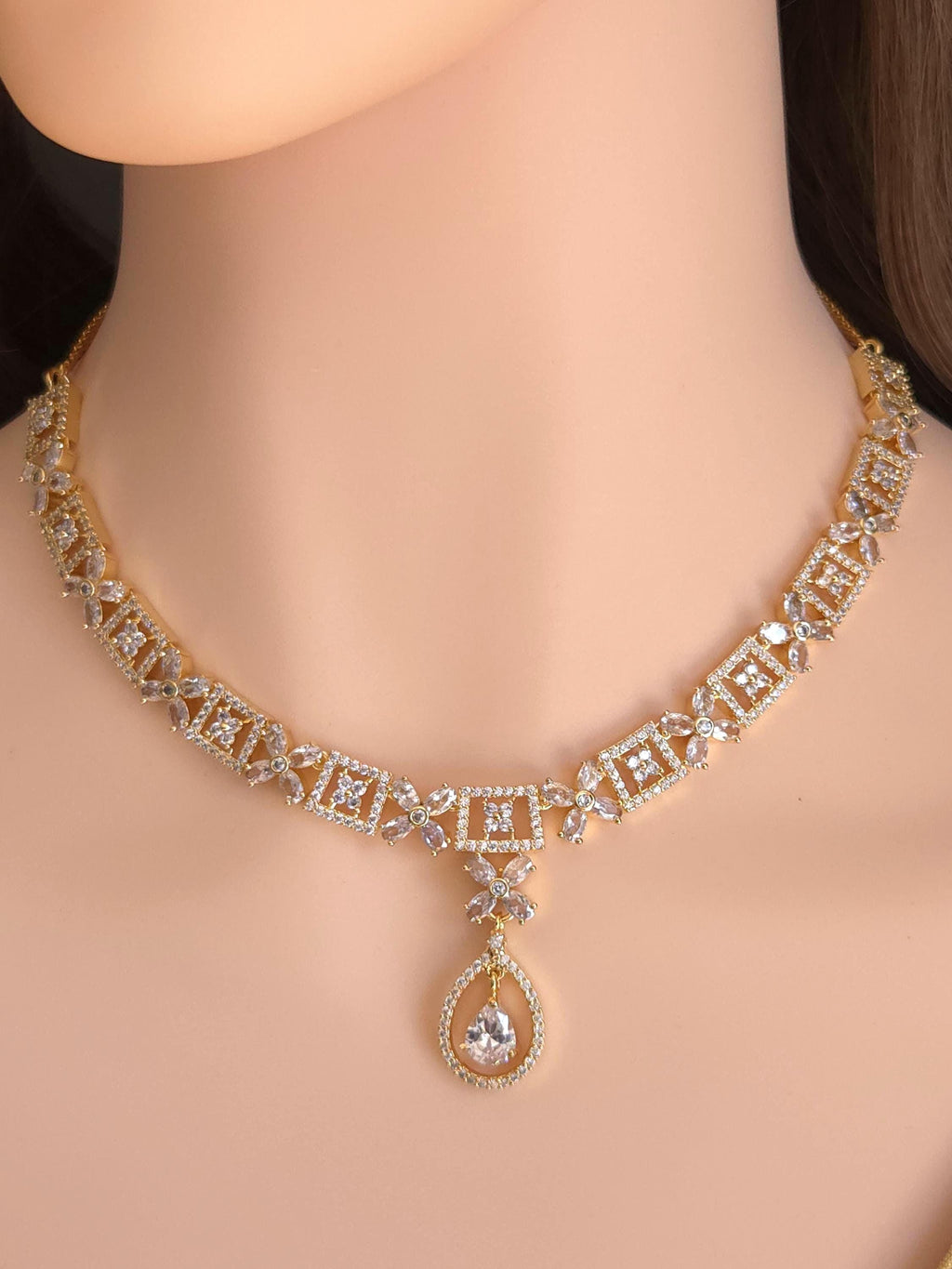 Clean geometric teardrop pendant golden base South Asian wedding assembly