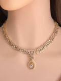 Clean geometric teardrop pendant golden base South Asian wedding assembly