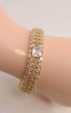 Solid gold overlay openable mechanism emerald cut center gem bangle