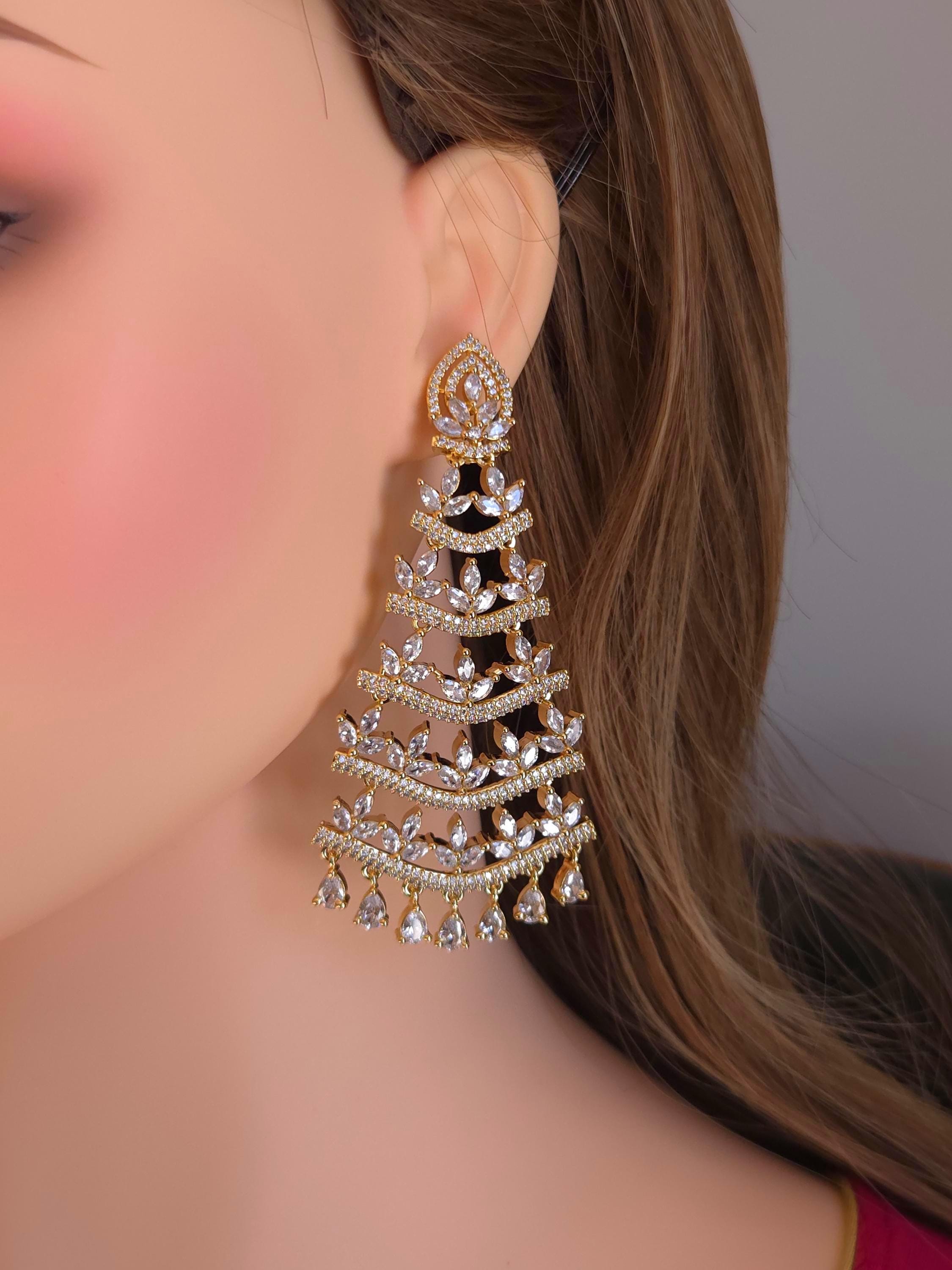 Elongated multi wire golden chandelier tassel earrings catalog reference index