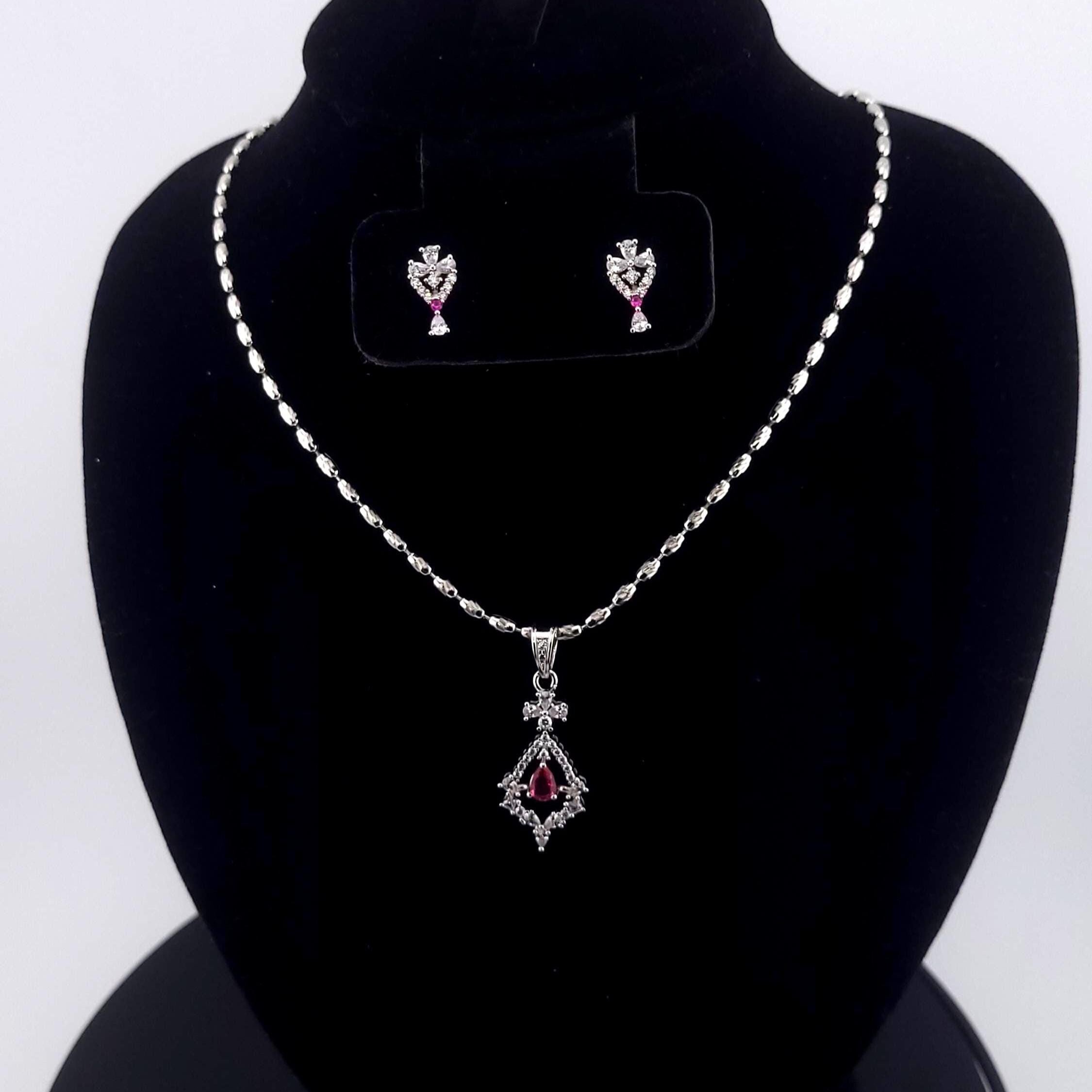 Sleek minimal execution red and blue stone geometric clear pendants