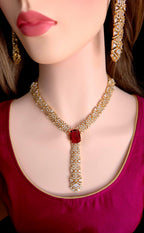 Majestic ruby long pendant line layout template on gold plate scale