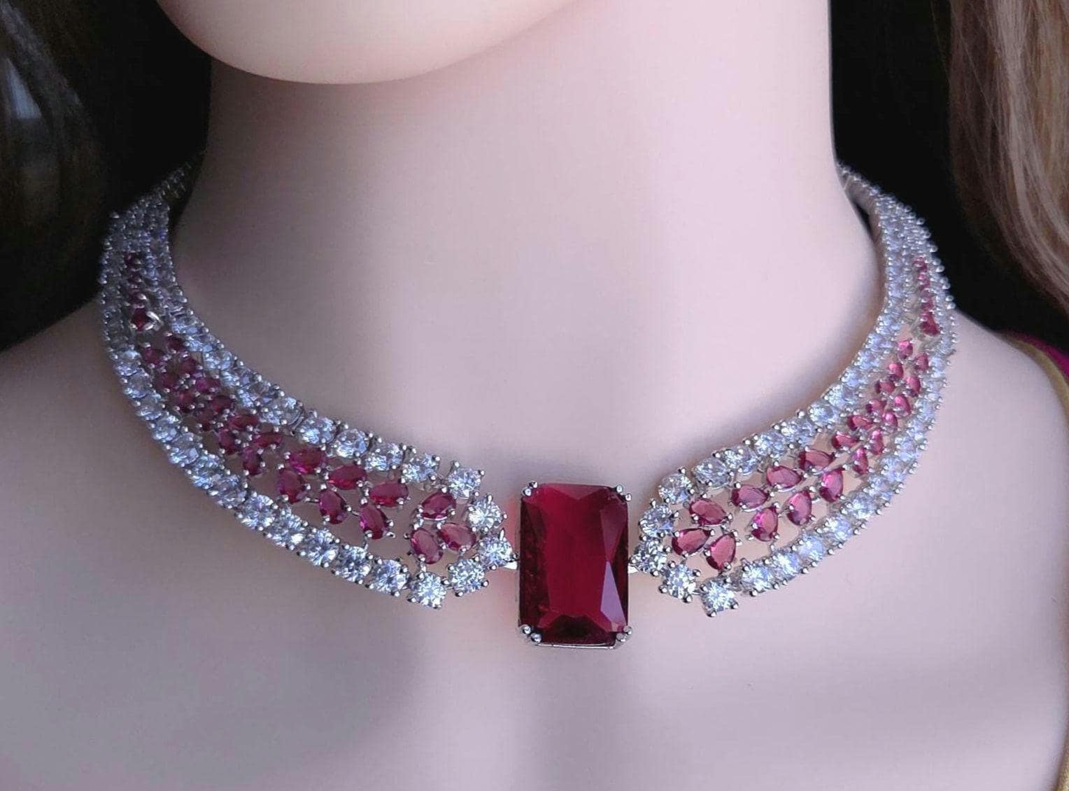 Modern emerald cut blood ruby and violet tone silver plate choke string