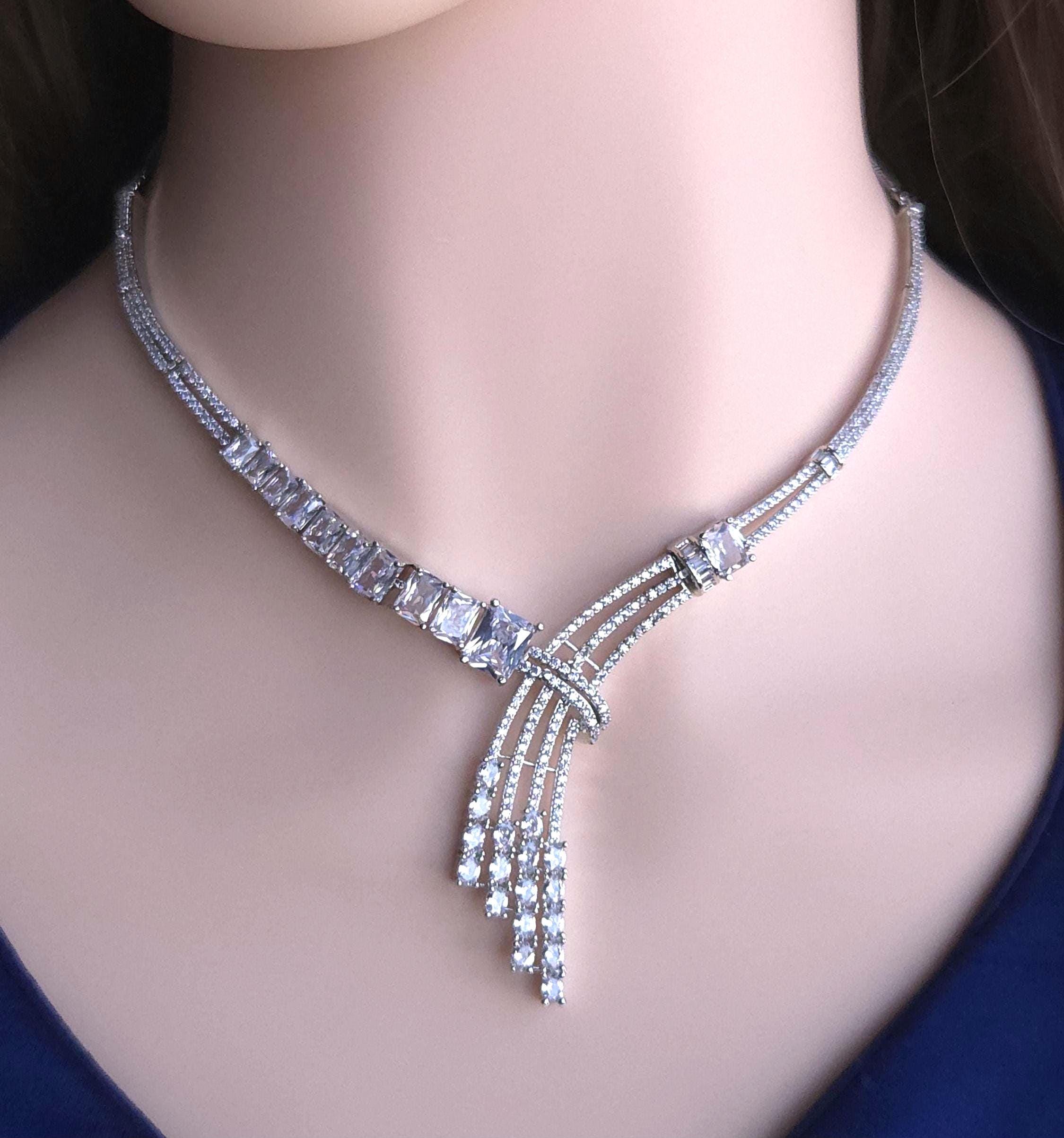 Dramatic Y profile silver setup featuring long hanging fringe tassel earrings