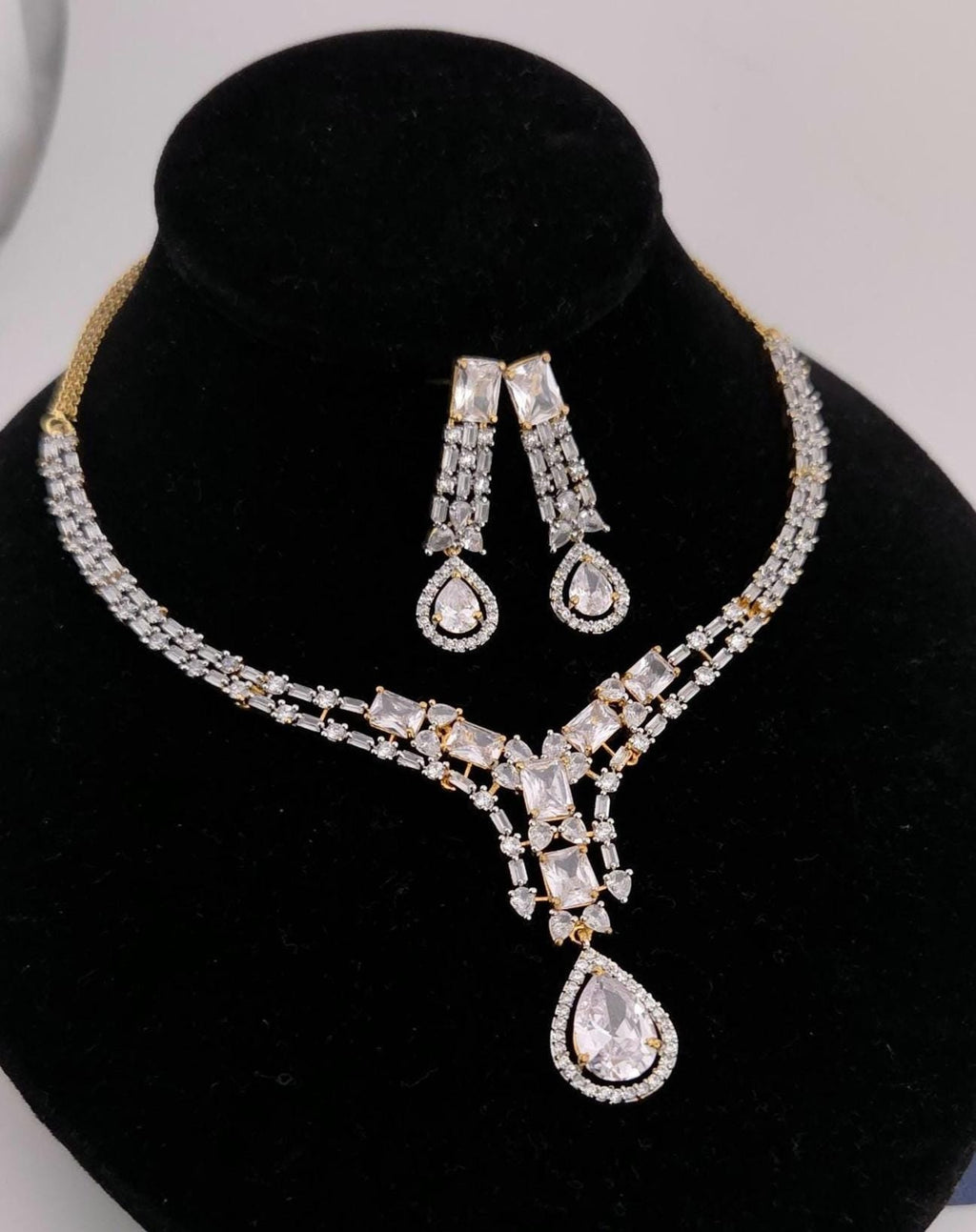 Grand multi branch layered clear cubic zirconia reception suite layout frame