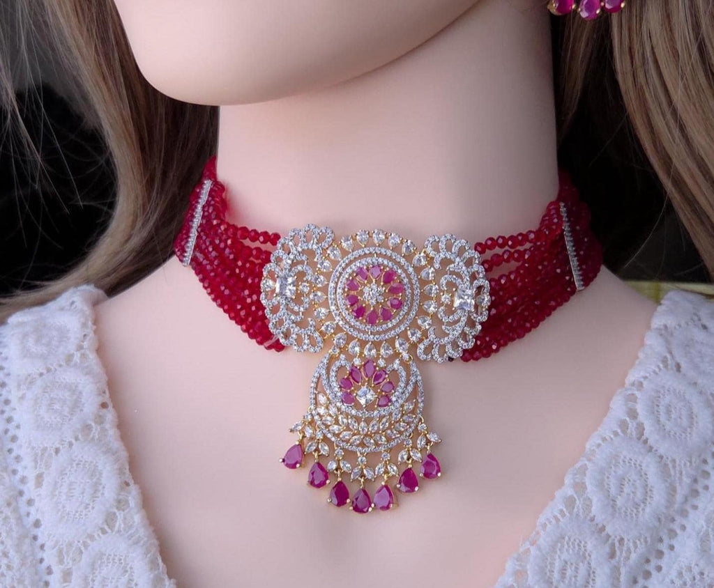 Traditional pink bead strings mixed with shining American Diamond choker layout