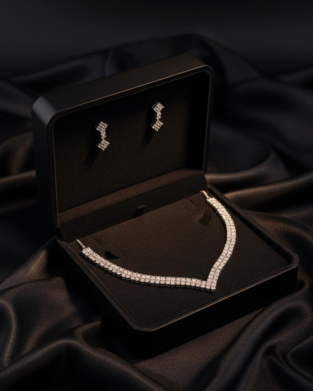Full view of silver CZ necklace and earrings set on display – wedding jewelry