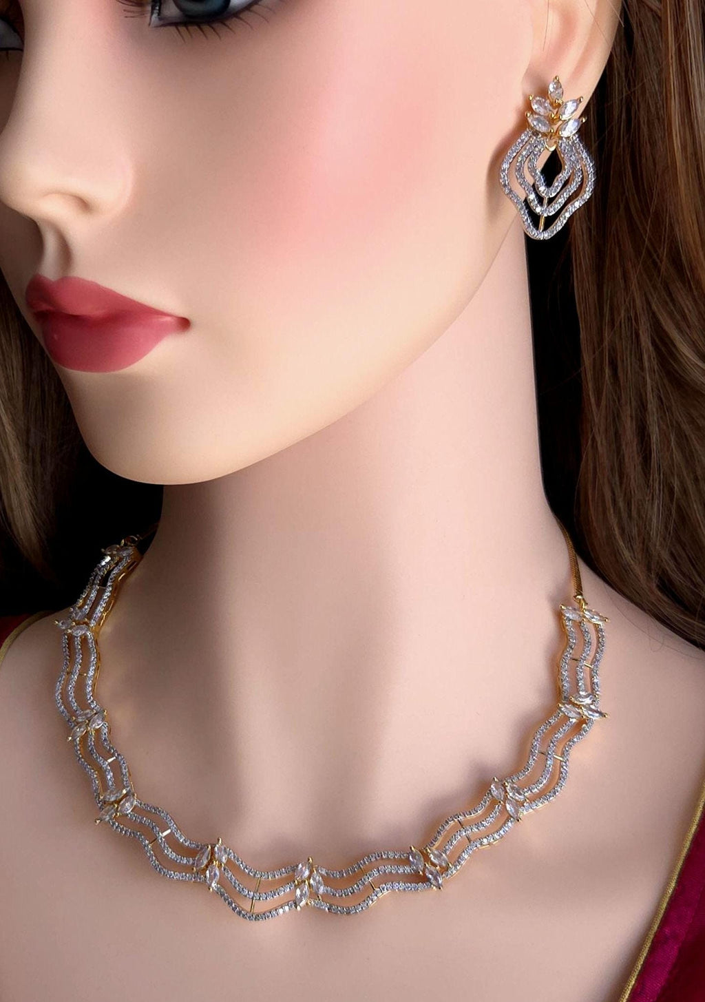 Mannequin wearing a diamond necklace and earrings on a dark background