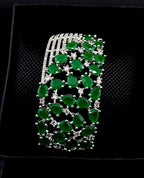 Green gemstone bracelet on a black background