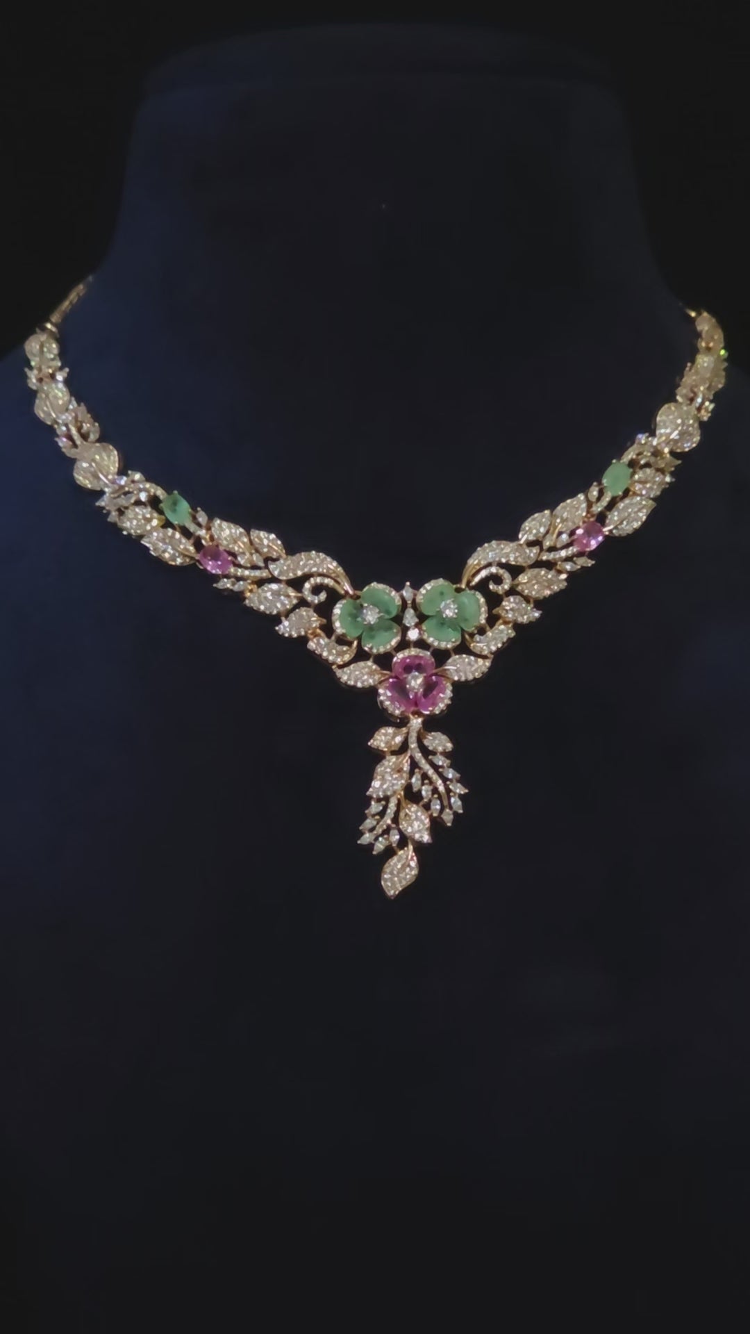 CZ Floral Garden Twin Bloom Necklace & Feather Drop Earring Set Gulnara – twin emerald green and pink CZ floral medallions with white CZ pavé vine-leaf chain and cascading feather drop in rose gold finish