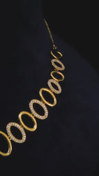 Video showcasing the gold-plated CZ oval link necklace and earring set with modern design