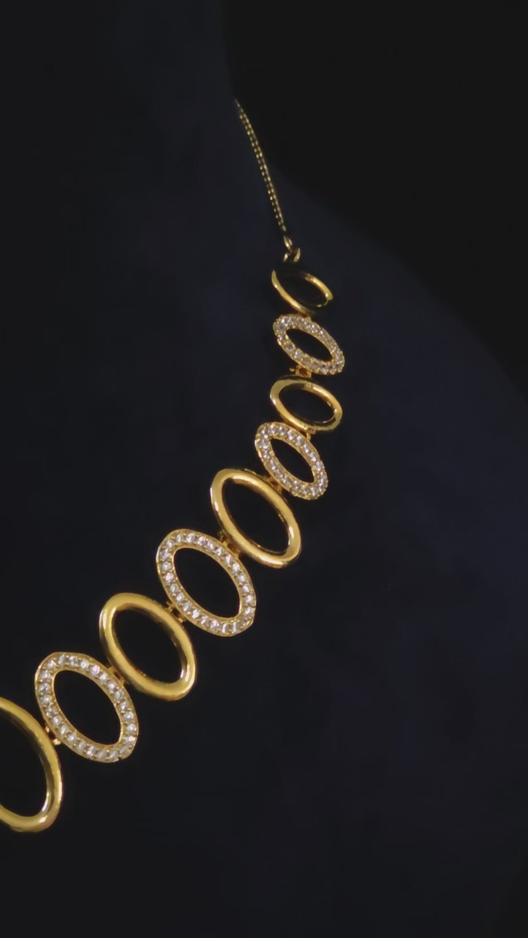 Video showcasing the gold-plated CZ oval link necklace and earring set with modern design