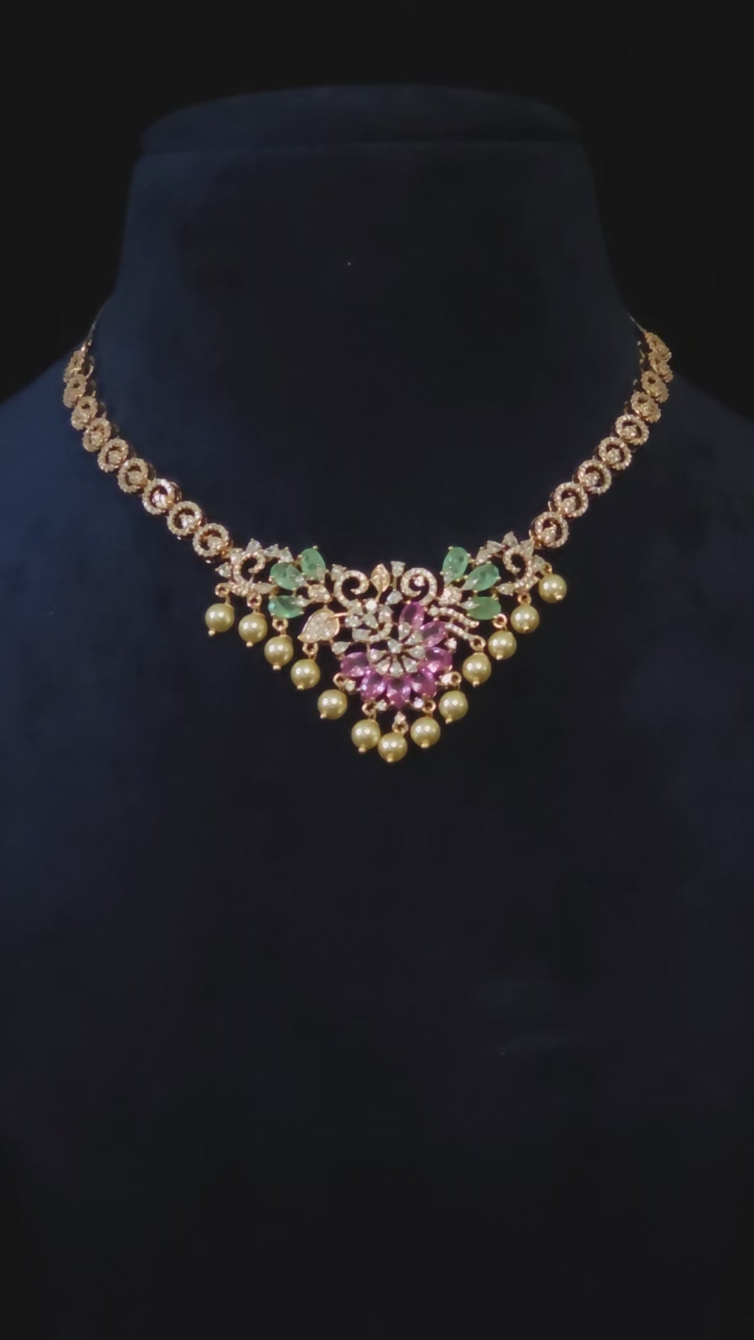 Pink & Emerald CZ Floral Pearl Drop Necklace & Earring Set Priya – pink marquise CZ floral pendant with emerald green CZ leaves, white CZ scrollwork chain, and cascading pearl drops in rose gold finish