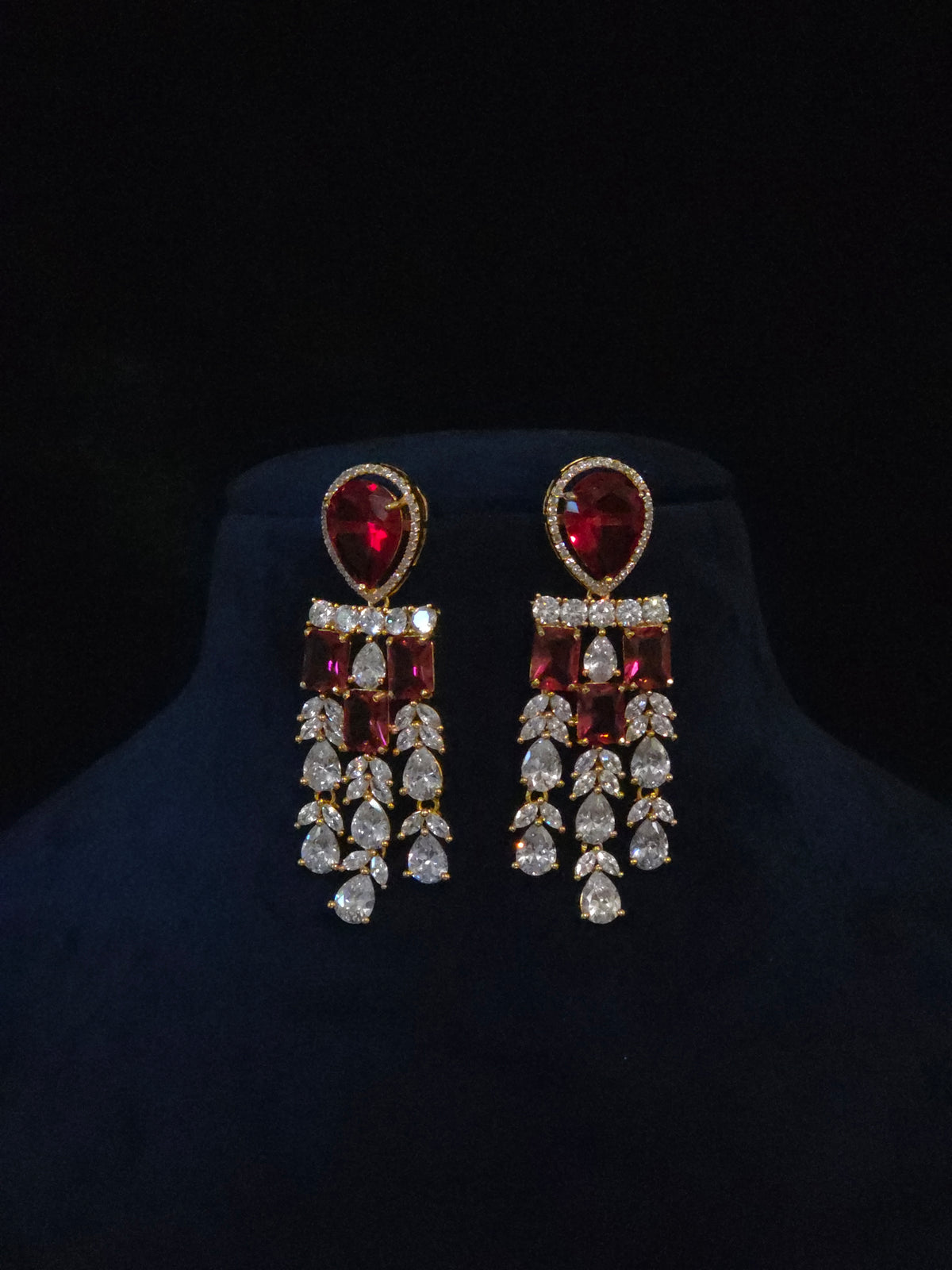 Pair of gold-plated ruby CZ chandelier earrings with pear-shaped top and cascading clear CZ drops