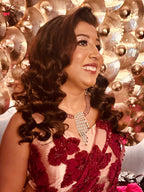 Model wearing the Riva cascade statement CZ necklace and matching drop earrings.