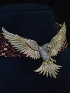 9.	Close-up of ruby CZ collar necklace and chandelier earrings styling detail