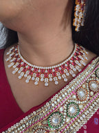 Close-up of a model wearing the gold-plated ruby CZ bridal choker and matching chandelier earring